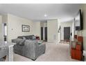 Bright and cozy living room with a plush gray sofa and a view of the entry at 483 Pender Woods Dr, Summerville, SC 29486