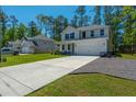 Attractive two-story home with a concrete driveway and well-kept lawn in a quiet neighborhood at 689 W Butternut Rd, Summerville, SC 29483
