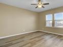 Neutral toned bedroom with wood floors and natural light from two windows at 819 Casey St, Moncks Corner, SC 29461