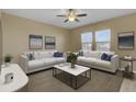 Bright living room featuring modern furniture, neutral tones, and large windows at 819 Casey St, Moncks Corner, SC 29461