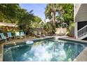 Refreshing backyard pool with ample seating, perfect for relaxing or entertaining guests in a private outdoor setting at 9 24Th Ave, Isle of Palms, SC 29451