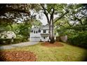 Charming two-story home with a manicured lawn and mature trees at 1178 Braddock Ave, North Charleston, SC 29406