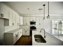 Modern kitchen with white cabinets, stainless steel appliances, and quartz countertops at 1178 Braddock Ave, North Charleston, SC 29406