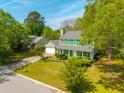 An eye-level aerial view of this home with green shutters surrounded by lush trees at 119 Alwyn Blvd, Summerville, SC 29485