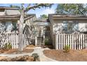 Charming home with a gated courtyard and covered entry steps at 1242 Creek Watch, Seabrook Island, SC 29455