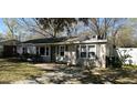 Charming single-story home with a welcoming front porch and neat, well-maintained yard at 125 Matheny Dr, Goose Creek, SC 29445