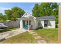 A guest house featuring a quaint porch with chairs and parking at 1324 Maxwell St, North Charleston, SC 29405