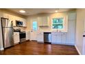 Bright kitchen featuring stainless steel appliances, granite countertops, and ample cabinet space at 1487 Woodview Ln, Charleston, SC 29412
