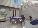 Cozy outdoor patio featuring a dining set and lounge chair, perfect for enjoying al fresco meals and relaxation at 1502 Marsh Haven, Seabrook Island, SC 29455