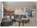 Cozy living room featuring a large sectional sofa and open layout to the kitchen at 153 Caleb Ct, Ladson, SC 29456