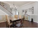 Open dining room showcasing a staircase and stylish decor at 177 Sugar Magnolia Way, Charleston, SC 29414