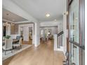 Inviting foyer showcases hardwood floors, white trim, and leads to multiple living spaces at 185 River Green Pl, Daniel Island, SC 29492
