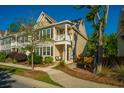 Attractive home with a inviting front porch, landscaped front yard, and sidewalk at 1865 Towne St, Johns Island, SC 29455
