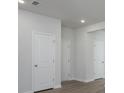 Hallway featuring neutral paint and doors at 205 W Bradford Pointe Dr, Summerville, SC 29483