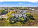 Scenic aerial view of homes nestled among lush greenery, showcasing the community and waterfront at 2105 Landfall Way, Seabrook Island, SC 29455