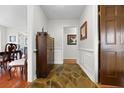 Inviting foyer with stone floors, custom moldings, and decorative wood cabinet at 22 Monte Sano Dr, Hanahan, SC 29410