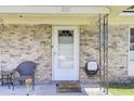 Inviting front porch featuring a white door and brick facade for a warm, welcoming entrance at 225 Arbor Rd, Summerville, SC 29485