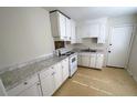 Bright kitchen featuring white cabinets, light countertops, and modern appliances at 318 Amy Dr, Goose Creek, SC 29445