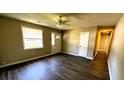 Neutral living room featuring wood flooring, a ceiling fan, and natural light at 3215 Bonanza Rd, Charleston, SC 29414