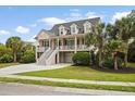 Charming two-story home with manicured lawn and driveway in established neighborhood at 3526 Stockton Dr, Mount Pleasant, SC 29466