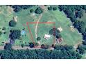 Aerial view showing property layout with home, land, and surrounding trees at 416 Jelly Rolls Rd, Moncks Corner, SC 29461