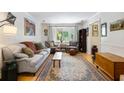 Inviting living room showcasing hardwood floors, comfortable furniture, and a large window with natural light at 5907 Murray Dr, Hanahan, SC 29410