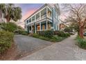 Gorgeous two-story home with a wrap-around porch, lush landscaping, and ample parking at 66 Warren St # Main House Only, Charleston, SC 29403