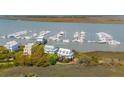Breathtaking aerial view of the waterfront community with boat slips near 68 W 9th Street at 0 We 10Th St, Folly Beach, SC 29439