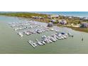 An aerial image shows multiple boat slips and waterfront homes in a charming coastal community at 0 We 10Th St, Folly Beach, SC 29439