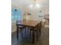 Dining room with a large wooden table, chairs, and a stylish chandelier at 1120 Seaside Ln, Charleston, SC 29412