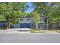 Charming two-story home features a two-car garage and mature trees at 14 Newark Ave, Goose Creek, SC 29445