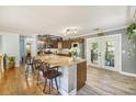 Open kitchen boasts granite countertops, stainless appliances, and a breakfast bar at 14 Newark Ave, Goose Creek, SC 29445