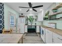 Bright kitchen features stainless steel appliances, modern cabinets, butcher block countertops, and a ceiling fan at 1450 E Montague Ave, North Charleston, SC 29405