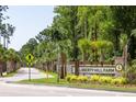 The entrance to Liberty Hill Farm showcases a tree-lined street and manicured landscaping at 1652 Siloh Ln # 474, Mount Pleasant, SC 29466