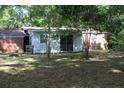 Backyard view of a single story home with white siding and a brick rear wall at 202 Easy, Goose Creek, SC 29445