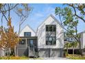 Stunning two-story house featuring large windows and a welcoming gray staircase at 2138 Boatwright Rd, Johns Island, SC 29455