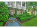 Charming front porch with well-manicured landscaping at 22 Fairhope Rd, Mount Pleasant, SC 29464