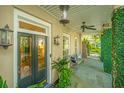 Inviting front porch featuring an elegant lantern, and cozy bench at 22 Fairhope Rd, Mount Pleasant, SC 29464