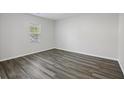 Bright, airy bedroom featuring sleek wood-look flooring and a sunlit window at 278 Decatur Dr, Summerville, SC 29483