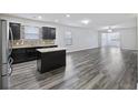 Open-concept kitchen and living area, showcasing modern cabinetry and stylish flooring at 278 Decatur Dr, Summerville, SC 29483