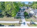 Aerial view of the two-story home, driveway, and manicured lawn, showcasing neighborhood and tree coverage at 2920 Newport Pl, North Charleston, SC 29420