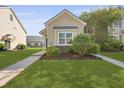 Charming single-Gathering home featuring a well-kept lawn and traditional design at 344 Flyway Rd, Goose Creek, SC 29445