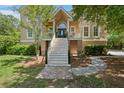 Welcoming front entrance with a grand staircase and detailed brick pathway leading to the front door at 3756 Colonel Vanderhorst Cir, Mount Pleasant, SC 29466