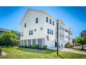 Side view of a charming two-story home featuring a well-manicured lawn at 571 Mclernon, Johns Island, SC 29455
