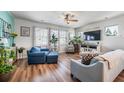 Inviting living room with hardwood floors, comfortable seating, and beach-themed decor at 571 Mclernon, Johns Island, SC 29455