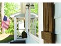 A close-up of charming exterior window box and white trim accents with patriotic American flag detail at 816 Savage Rd, Charleston, SC 29414