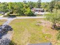 Areal view of the property's proximity to a nearby commercial property, trees, and nearby street at 1128 Melvin Bennett Rd, Mount Pleasant, SC 29464