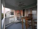 Relaxing balcony featuring a hanging chair, table, and views of the complex at 141 Marsh View Villas, Folly Beach, SC 29439