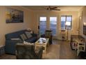 Cozy living room with comfortable seating and views of the landscape at 141 Marsh View Villas, Folly Beach, SC 29439