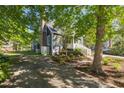 A spacious yard featuring a brick-lined gravel driveway and a well-maintained lawn at 1516 Village Sq, Mount Pleasant, SC 29464
